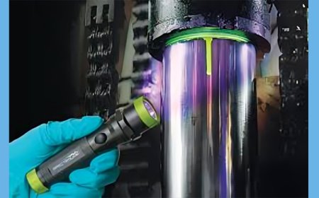 How do you identify the source of a hydraulic leak and repair it?