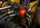 What causes a hydraulic valve to overheat?