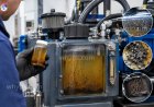 What causes hydraulic fluid contamination?