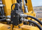 What are pilot-operated check valves, and where are they used?