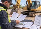 What documents should you check when buying used heavy equipment?